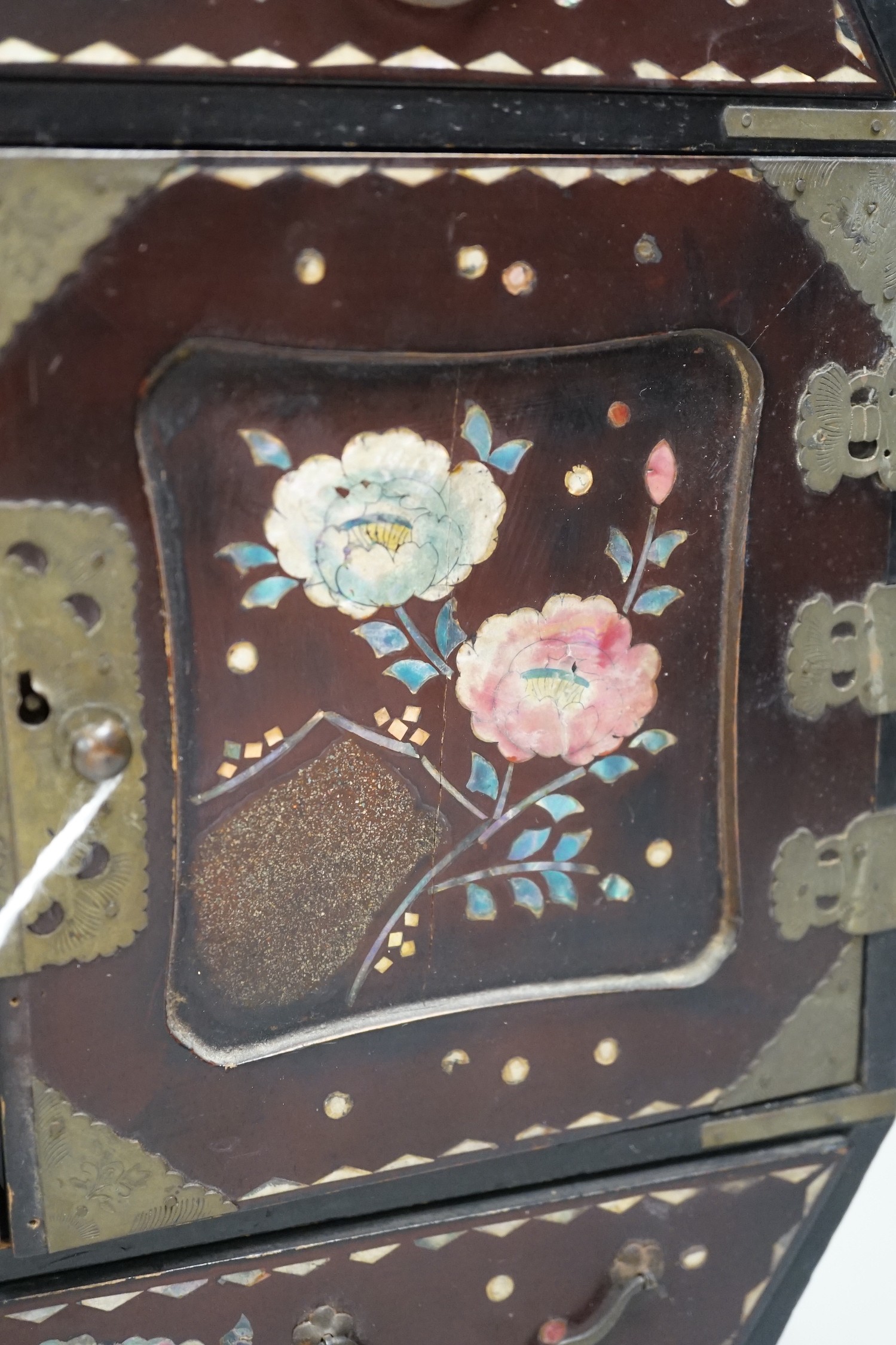 A Japanese inlaid mother-of-pearl miniature chest. 36cm tall